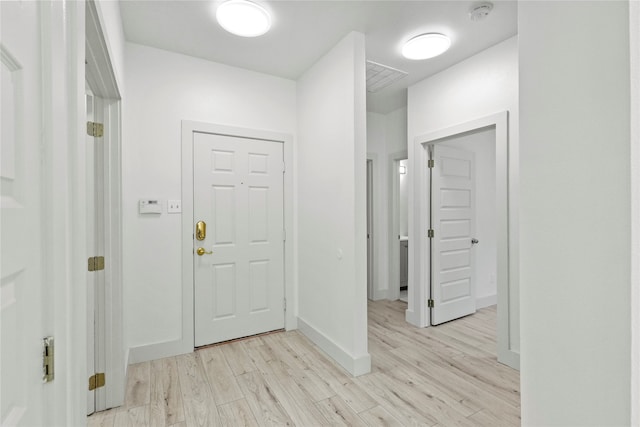 foyer with light hardwood / wood-style flooring