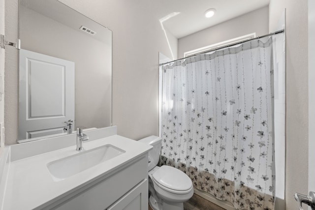 full bathroom with toilet, vanity, and shower / bathtub combination with curtain