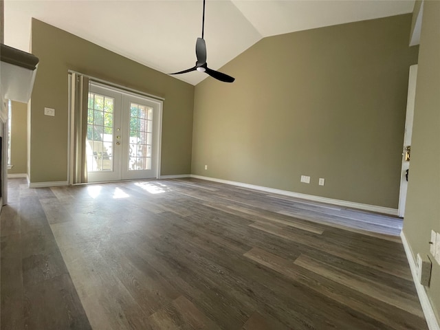 empty room with french doors, dark hardwood / wood-style floors, ceiling fan, and lofted ceiling