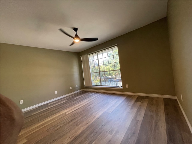 spare room featuring ceiling fan and wood-type flooring