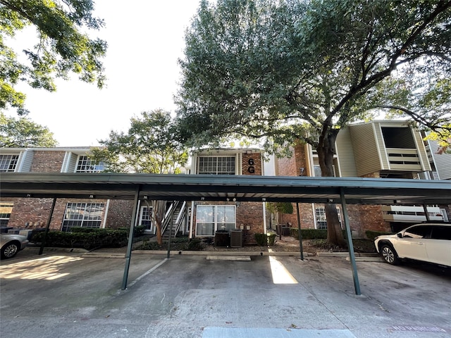 view of parking / parking lot featuring a carport