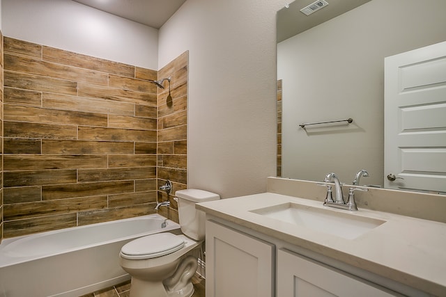 full bathroom featuring vanity, toilet, and tiled shower / bath combo