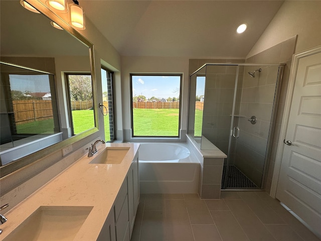 bathroom featuring lofted ceiling, tile patterned floors, vanity, and plus walk in shower