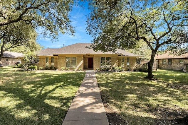 ranch-style home with a front yard