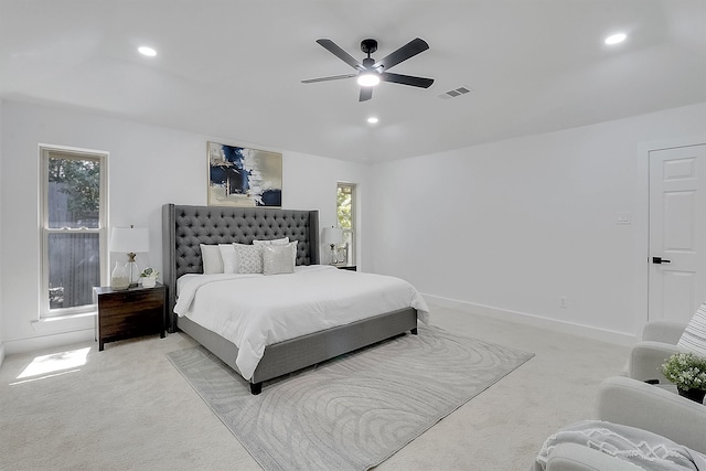 bedroom featuring ceiling fan and light carpet