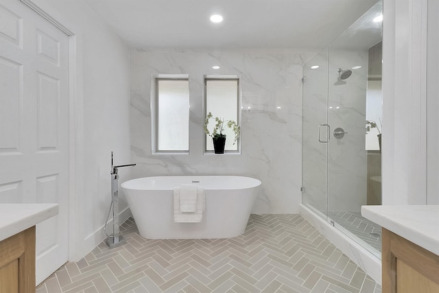 bathroom featuring separate shower and tub and vanity