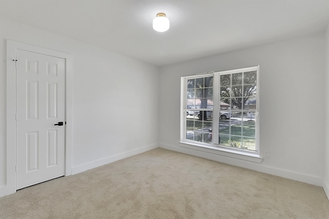 empty room featuring light carpet