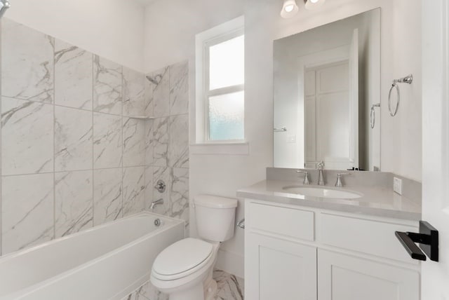 bathroom featuring toilet, marble finish floor,  shower combination, and vanity