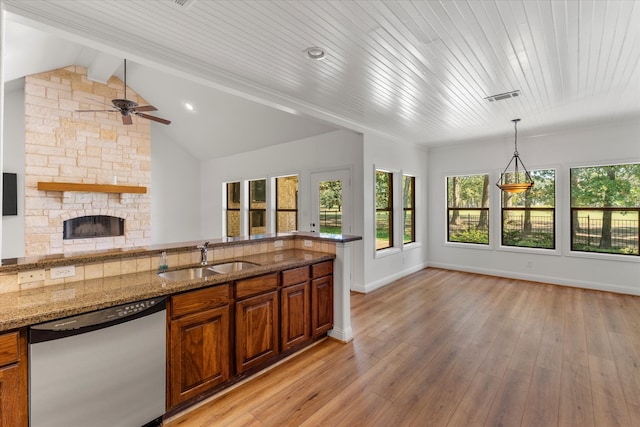 kitchen with sink, light hardwood / wood-style floors, dishwasher, and stone counters