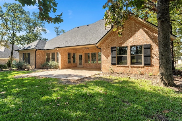 back of house featuring a patio and a lawn