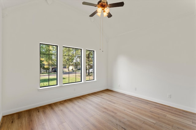 unfurnished room featuring lofted ceiling with beams, ceiling fan, and light hardwood / wood-style floors