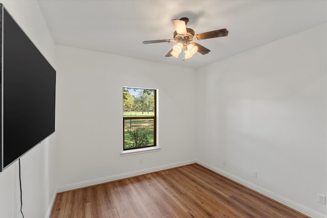 empty room featuring ceiling fan and light wood-type flooring