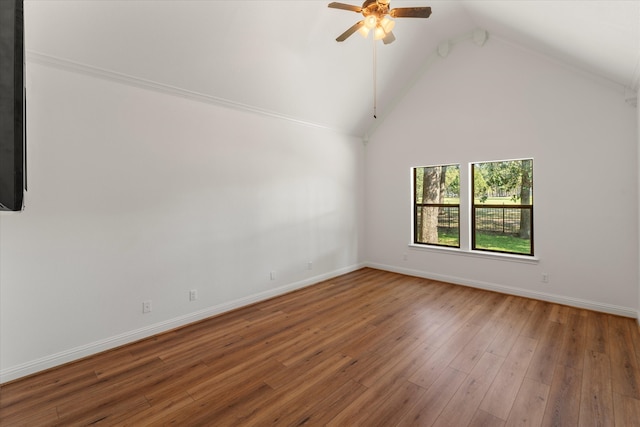 interior space with ceiling fan, lofted ceiling, and wood-type flooring