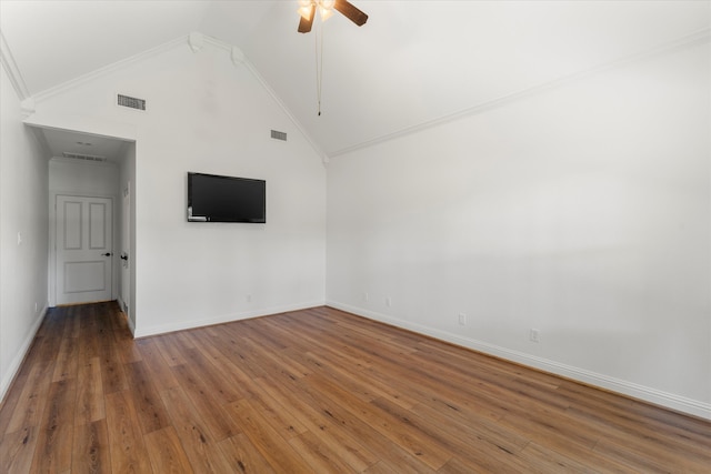 empty room with ceiling fan, hardwood / wood-style floors, ornamental molding, and high vaulted ceiling