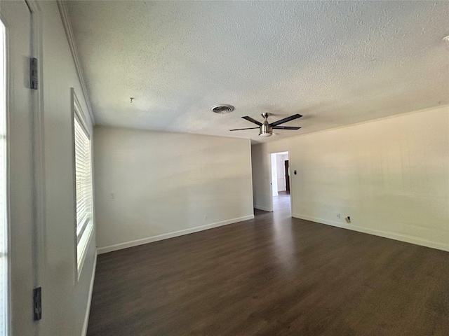 unfurnished room with ceiling fan, dark hardwood / wood-style floors, and a textured ceiling