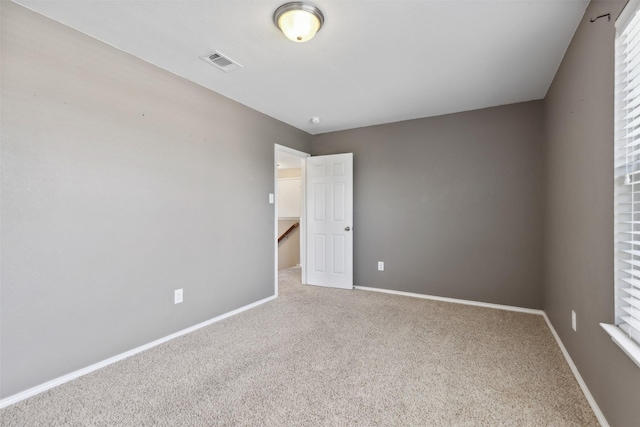 empty room featuring carpet floors