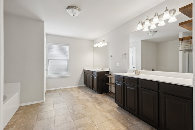 bathroom with vanity, a bathtub, and tile patterned flooring