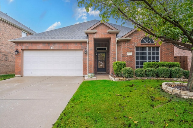 view of front facade featuring a front yard and a garage