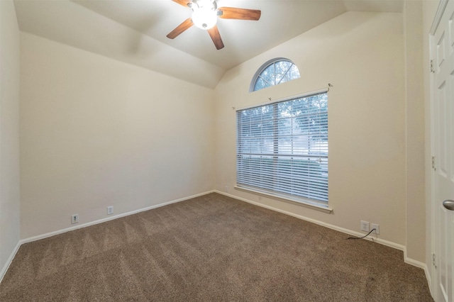 carpeted spare room with ceiling fan and lofted ceiling