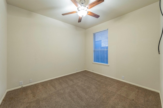 empty room with ceiling fan and carpet