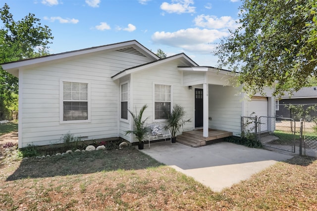 view of front of house with a patio and a front yard