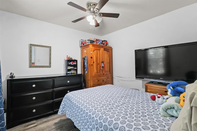 bedroom featuring ceiling fan and hardwood / wood-style floors