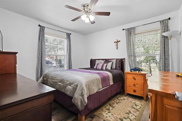 bedroom with hardwood / wood-style flooring and ceiling fan