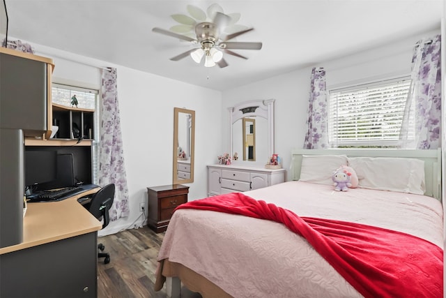 bedroom featuring ceiling fan and dark wood-type flooring