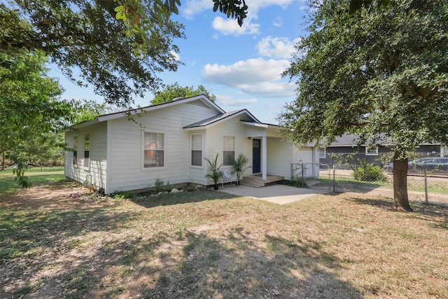 ranch-style home with a front lawn