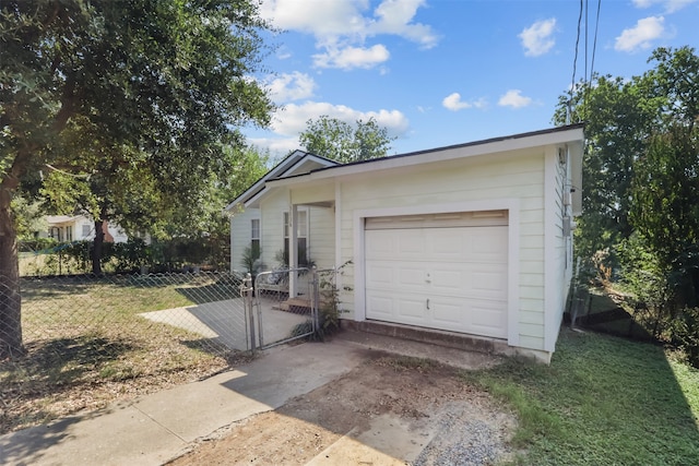 garage with a yard