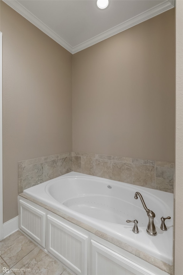 bathroom with tile patterned floors, a bathtub, and ornamental molding