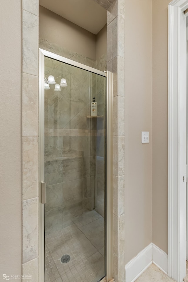 bathroom featuring an enclosed shower