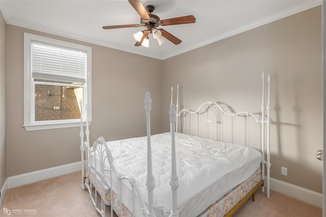 bedroom with ceiling fan, crown molding, and light colored carpet