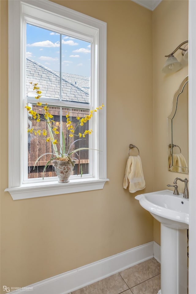 bathroom featuring tile patterned flooring and a wealth of natural light