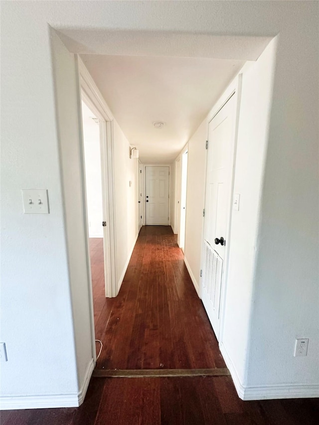 729 N Ruddell St, Denton, TX 76209 - hallway with dark wood-style floors and baseboards