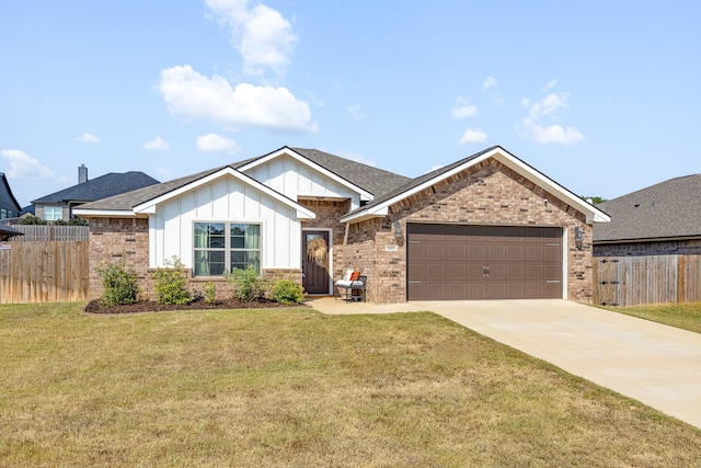 view of front of house with a garage and a front lawn