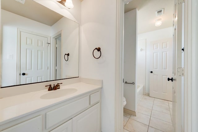 full bathroom with vanity, tile patterned flooring, toilet, and shower / washtub combination