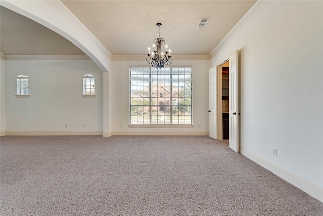 spare room with light colored carpet, an inviting chandelier, and ornamental molding