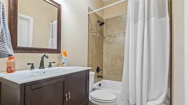 full bathroom featuring vanity, shower / tub combo, and toilet