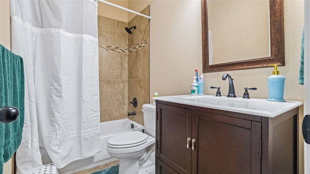 full bathroom with vanity, shower / bath combo with shower curtain, and toilet