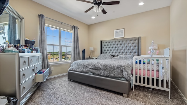 carpeted bedroom featuring ceiling fan