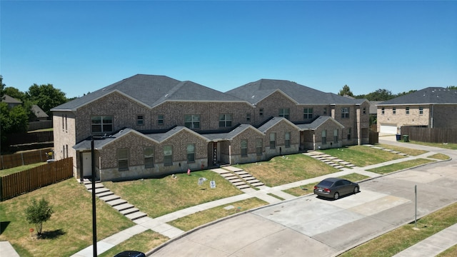 view of front facade with a garage and a front yard