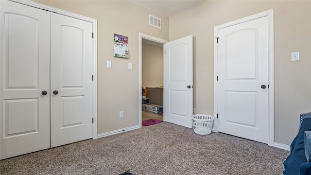 unfurnished bedroom featuring a closet and carpet