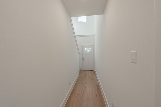 hall with light hardwood / wood-style floors