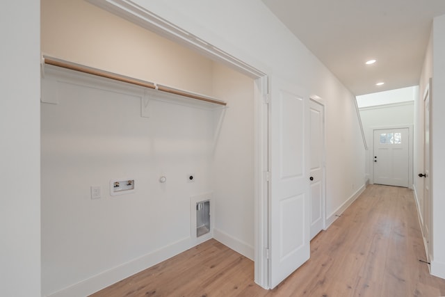 laundry area with hookup for an electric dryer, hookup for a washing machine, light hardwood / wood-style floors, and hookup for a gas dryer