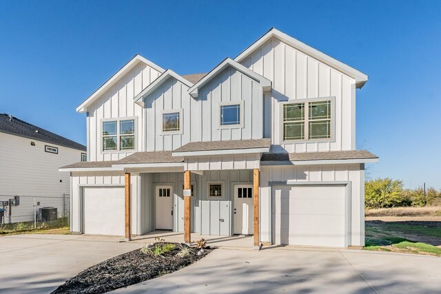 modern inspired farmhouse with central AC and a garage