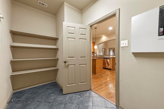 corridor with dark wood-type flooring