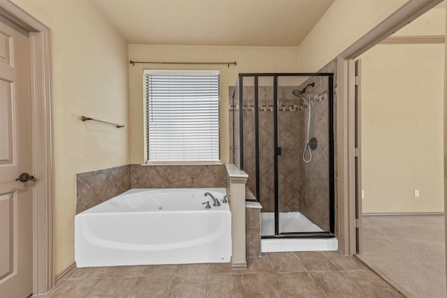 bathroom with shower with separate bathtub and tile patterned floors