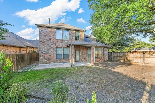 back of property with a patio