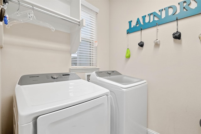 washroom featuring washing machine and dryer